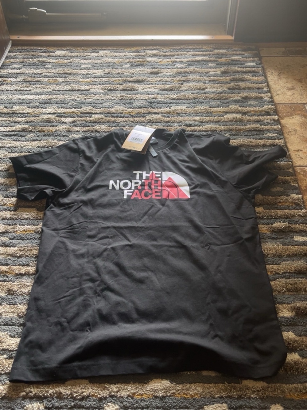 The North Face Men’s Black Tee with Pink & White Logo